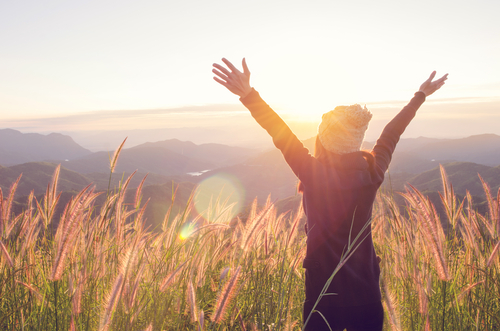woman enjoying the sunrise