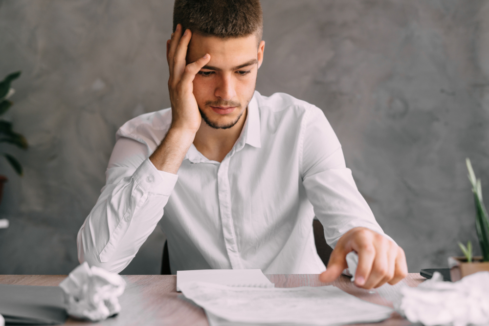 the guy looks at the bankruptcy documents