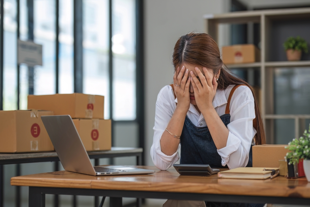 Asian woman with unsuccess business online shopping crying and serious face unhappy mood