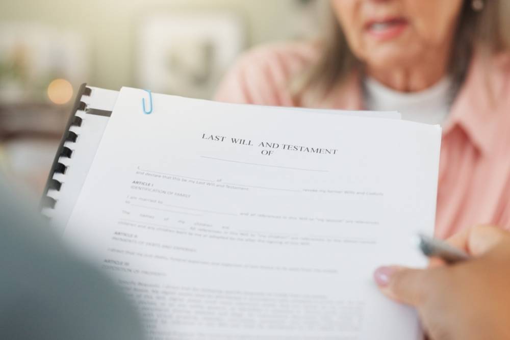 Lawyer, documents or contract with senior for testament, last will or legal agreement of property.